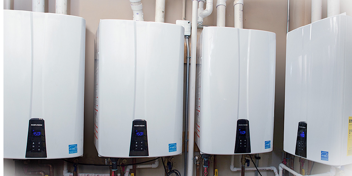 Image of four tankless water heaters professionaly installed